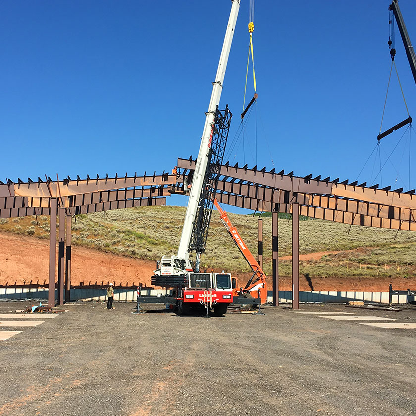 Metal workers on a building.